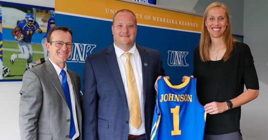 UNK women’s basketball coaches Drew and Nicole Johnson are pictured with Athletic Director Marc Bauer, left, during an introductory press conference in May 2023. (UNK Communications)